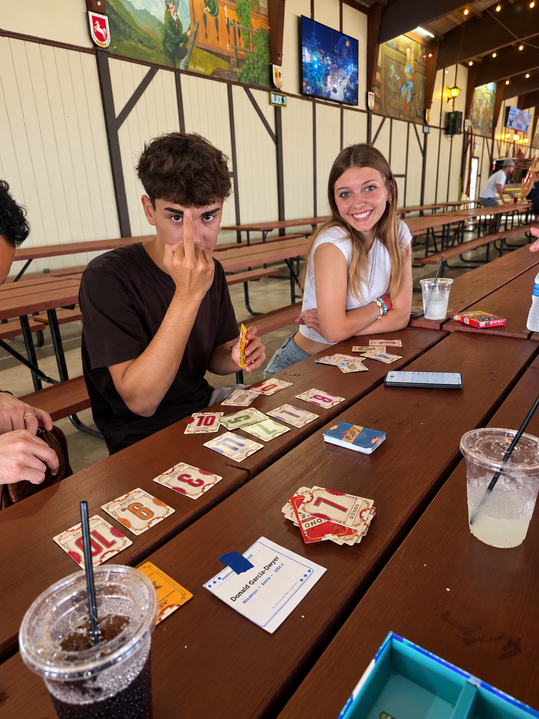 Alvaro and a friend playing cards together at the Bavarian Bierhaus Oktoberfest.